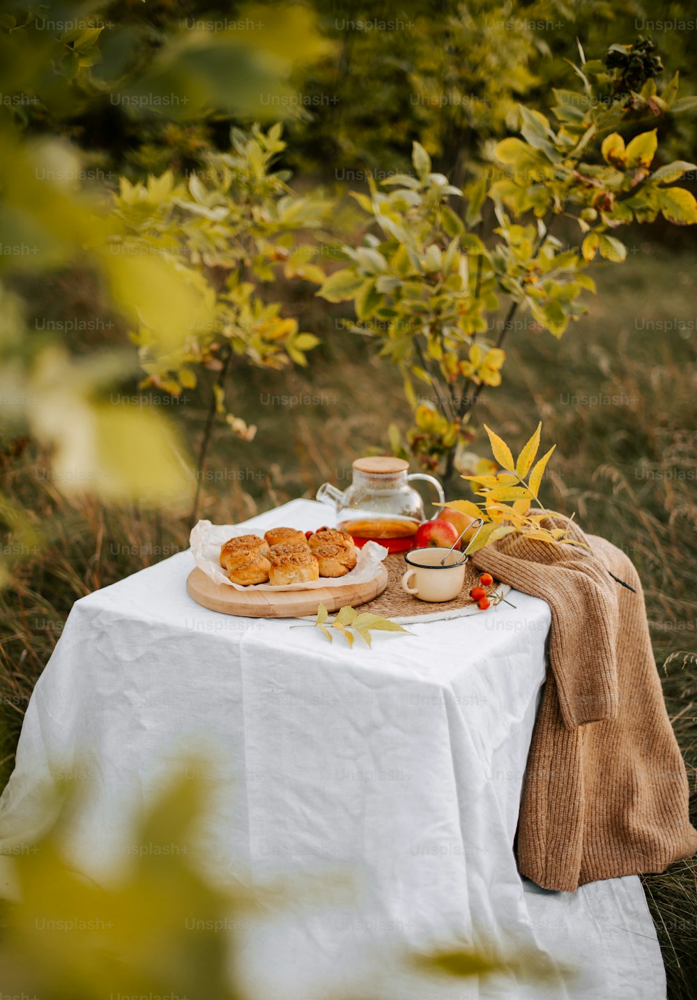 a plate of food sitting on top of a white table