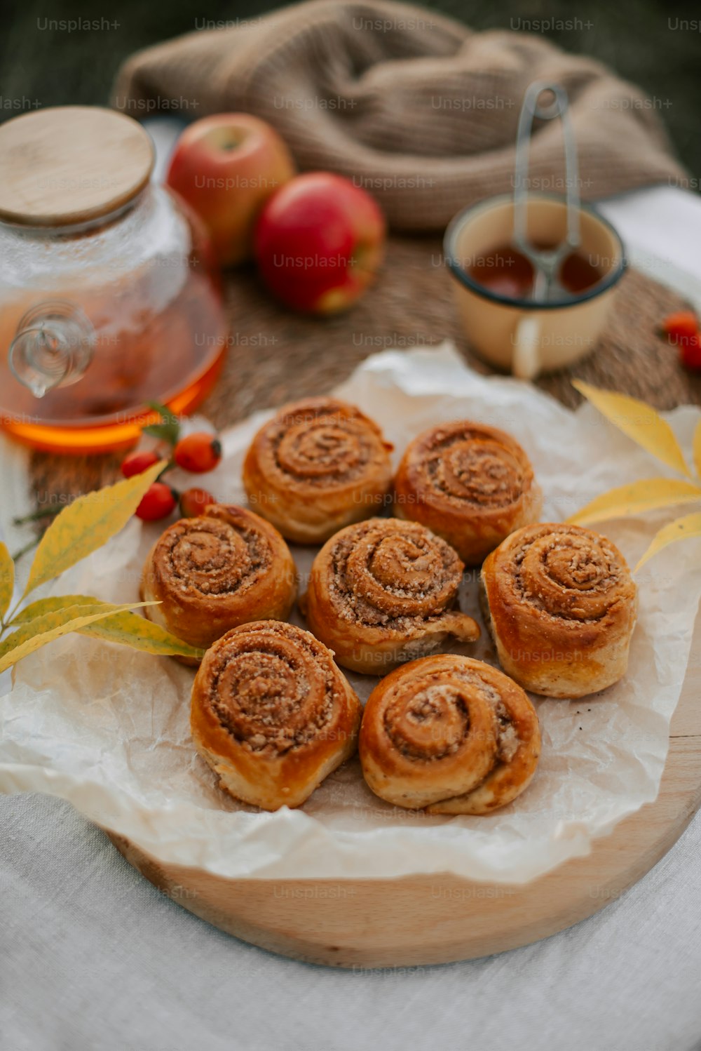 a plate of cinnamon rolls on a table