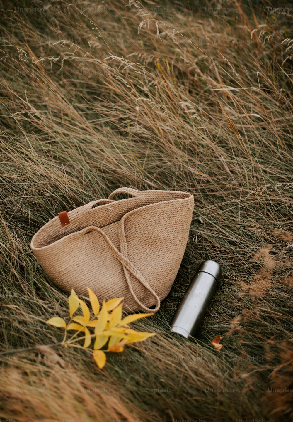 a small bag and a lighter on the ground