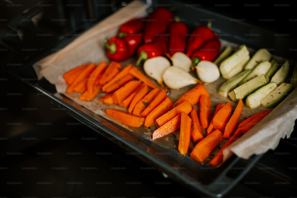 a tray of cut up vegetables on a table