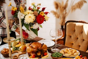 a table is set with a turkey and a glass of wine