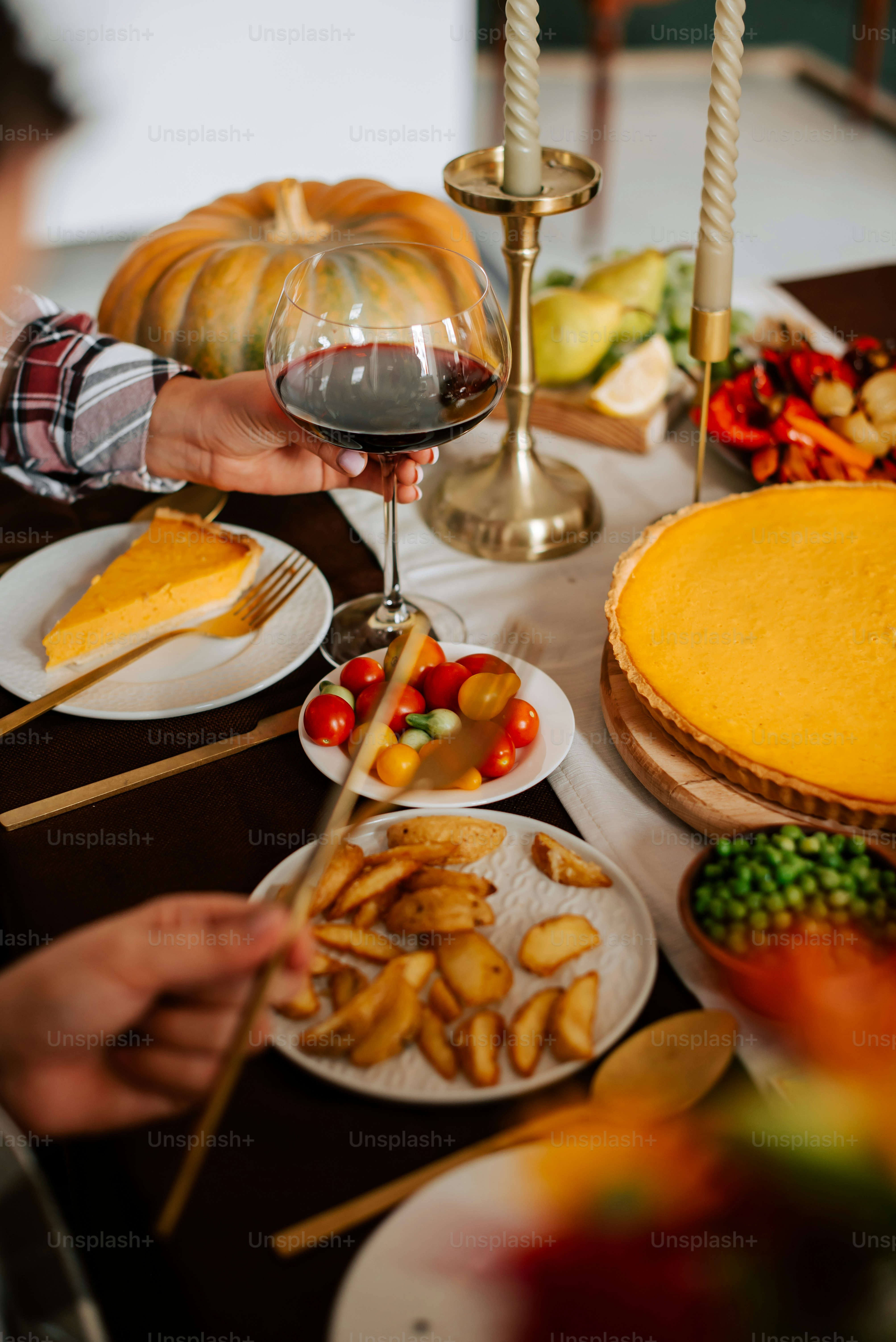 a table filled with food and a glass of wine