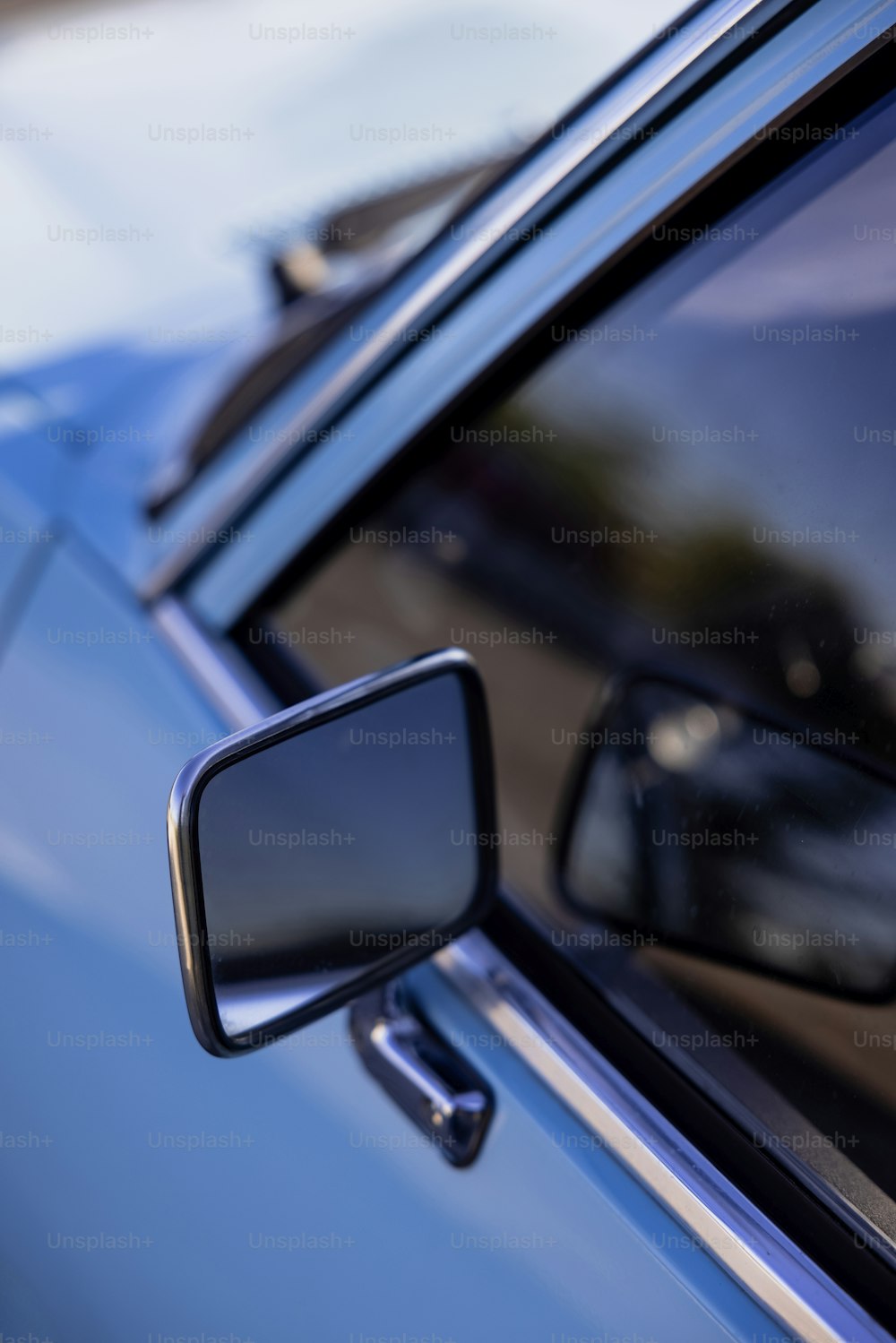 a side view mirror on a blue car