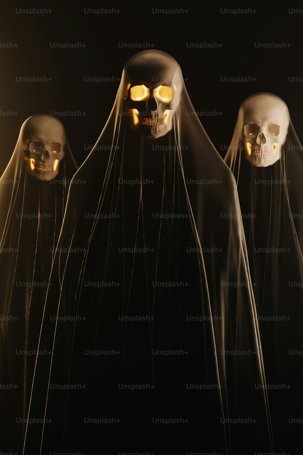 a group of three skeletons with glowing eyes