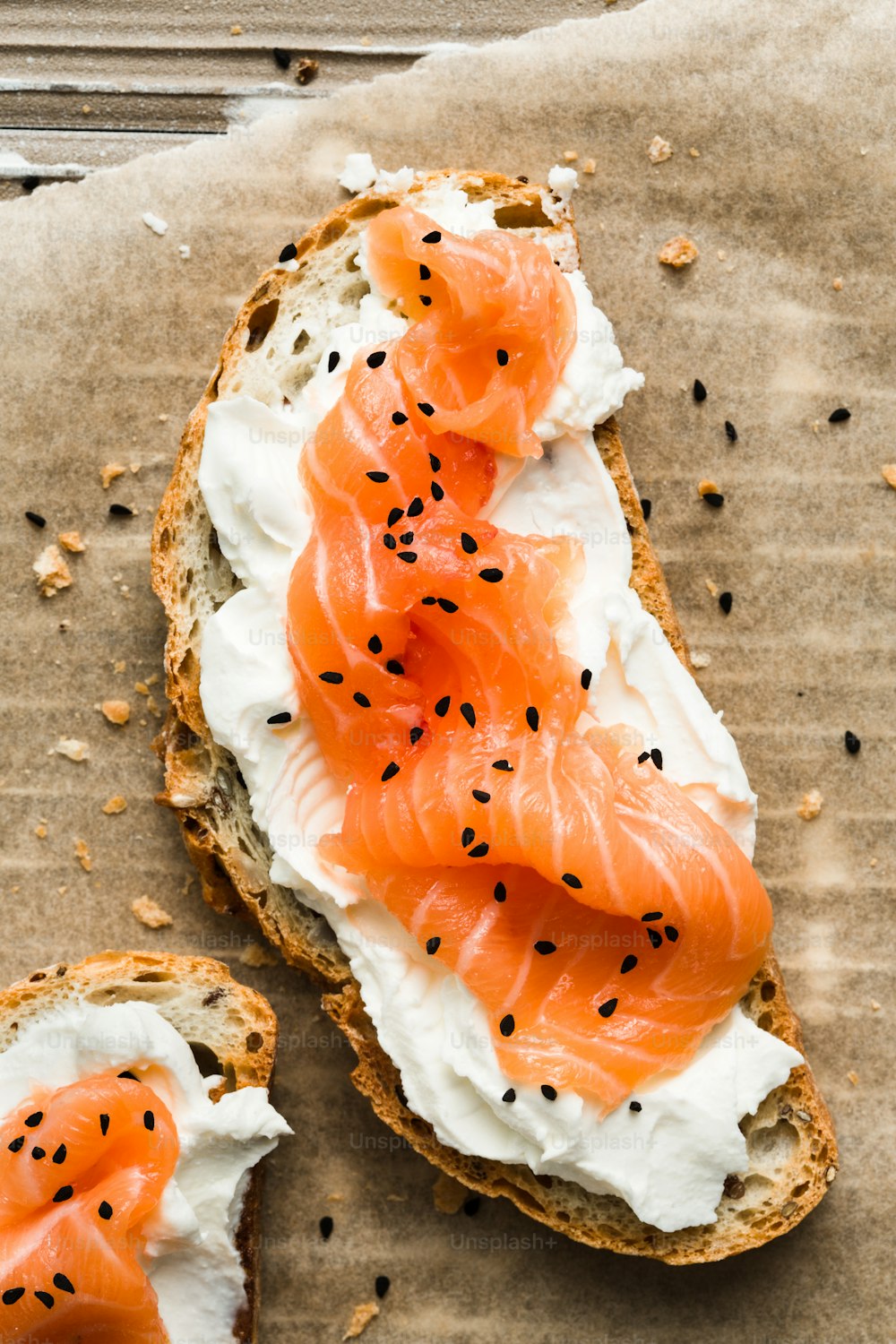 a piece of bread with cream cheese and salmon on it