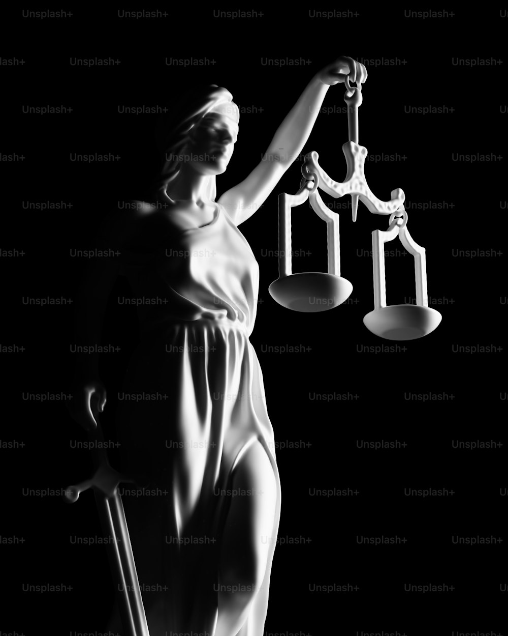 a statue of lady justice holding a sword and a scale