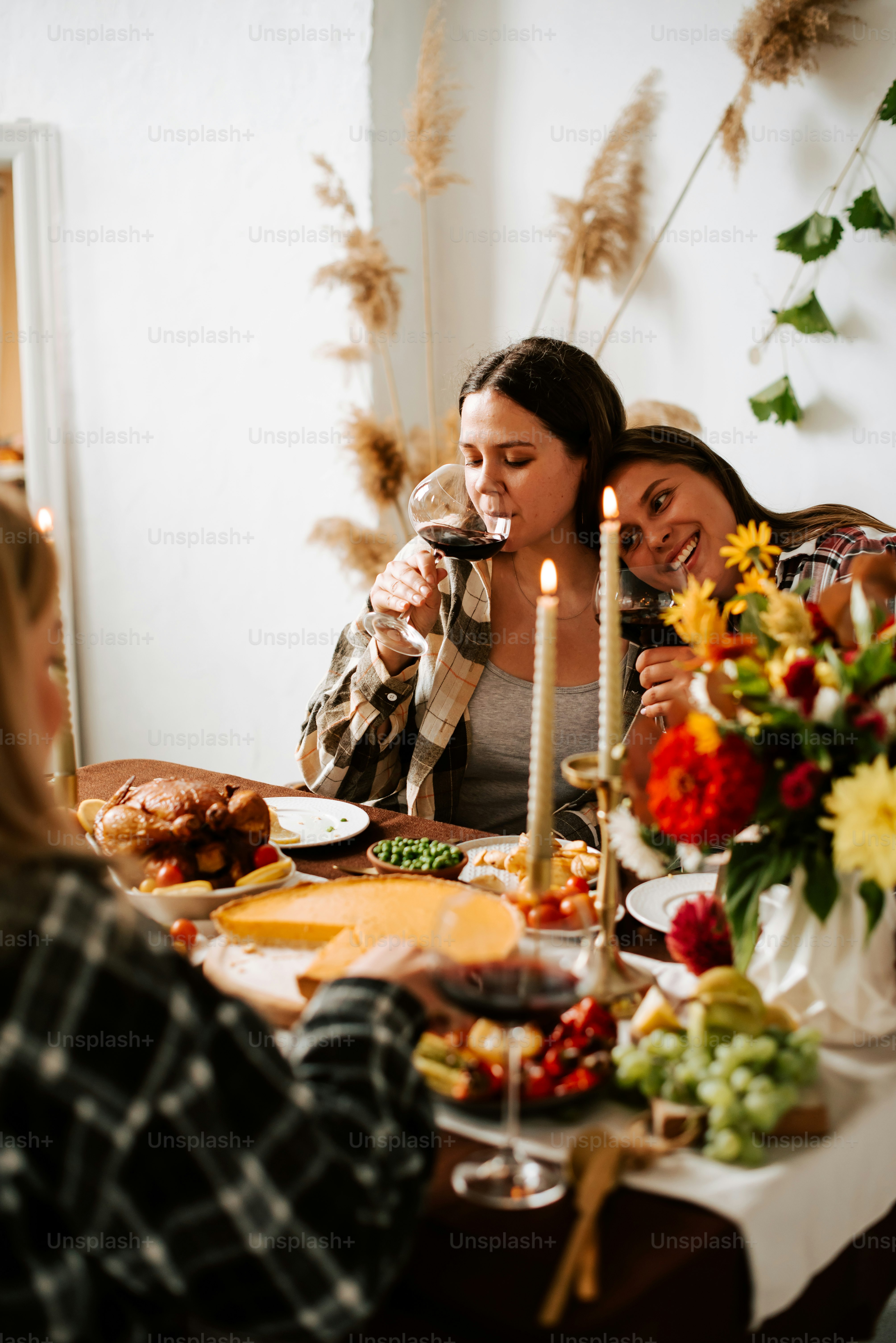 a group of women sitting around a dinner table