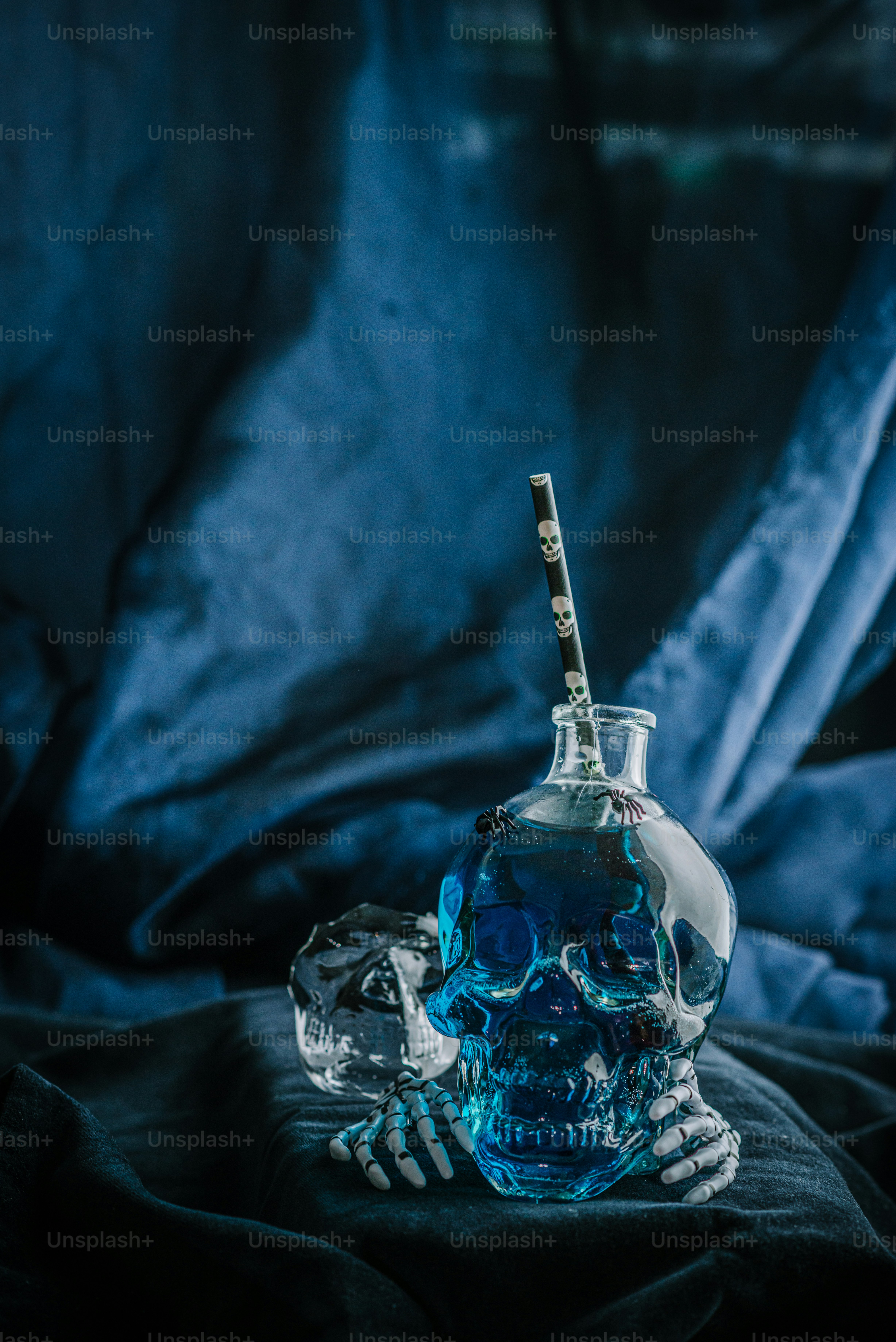 a skull shaped bottle with a toothbrush in it