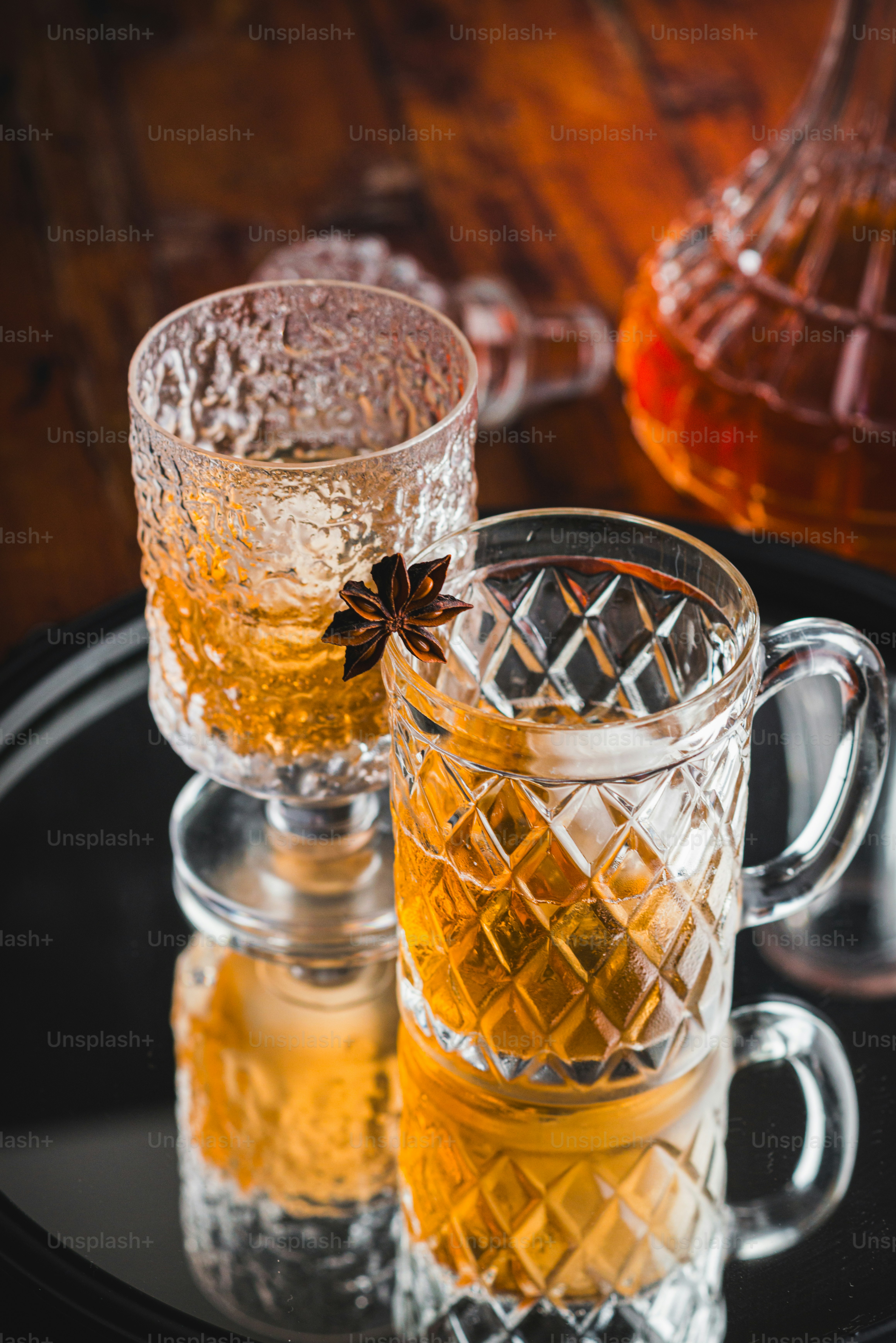 two glasses of tea sit on a tray