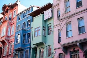 a row of multicolored buildings in a city