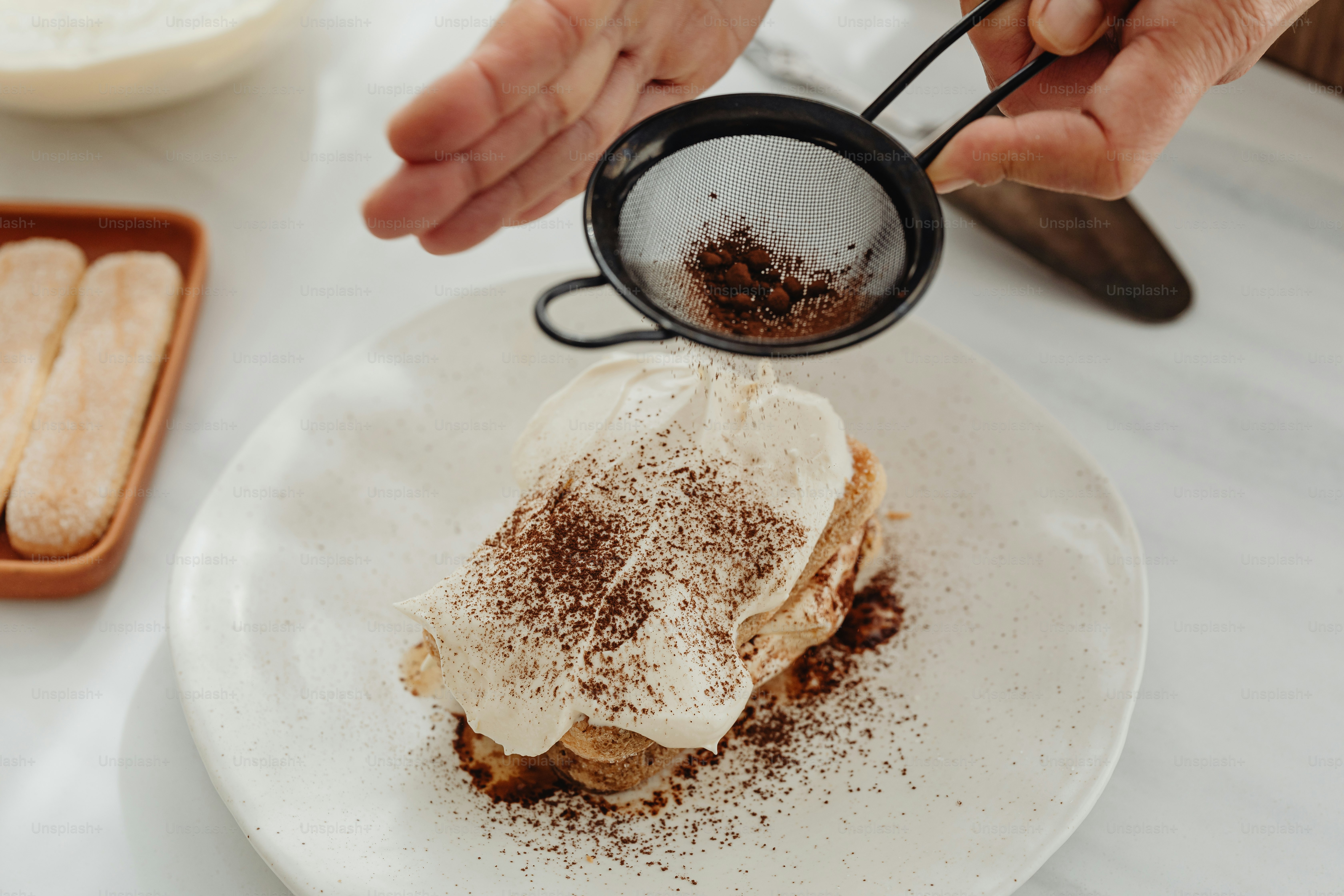 a person pours coffee into a dessert on a plate