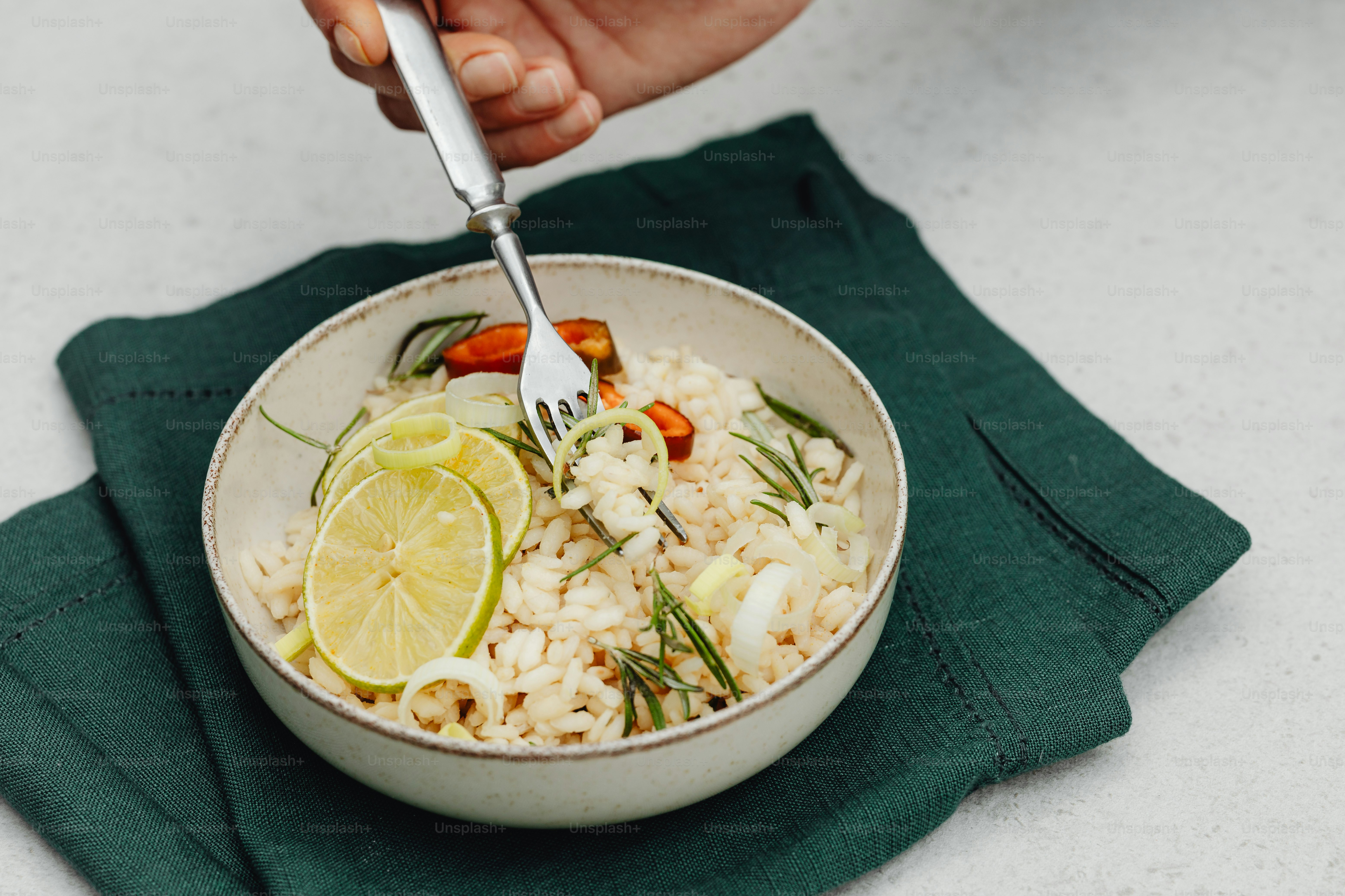 A white bowl filled with rice and vegetables photo – Risotto Image on ...