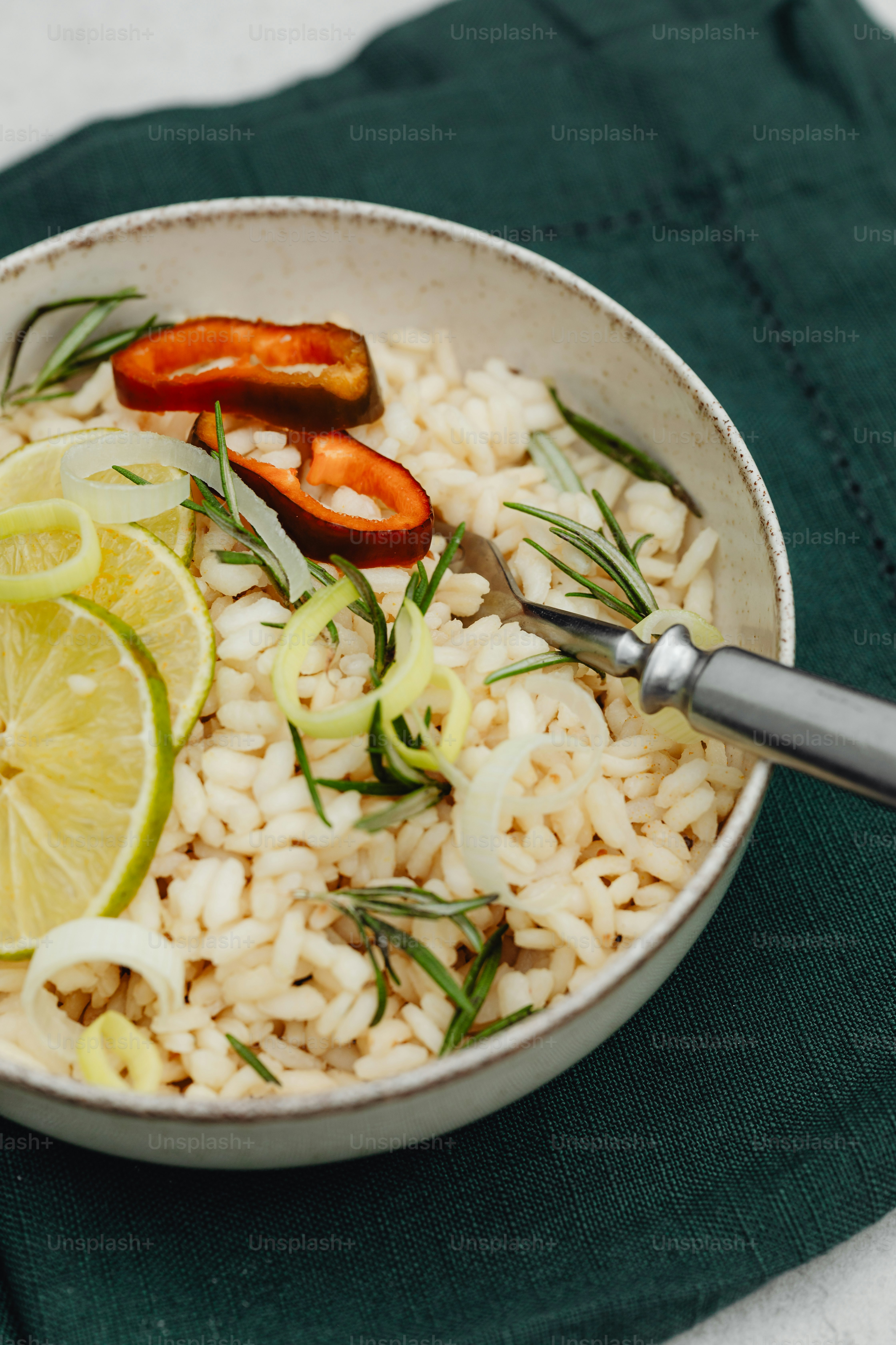 A white bowl filled with rice and vegetables photo – Risotto Image on ...