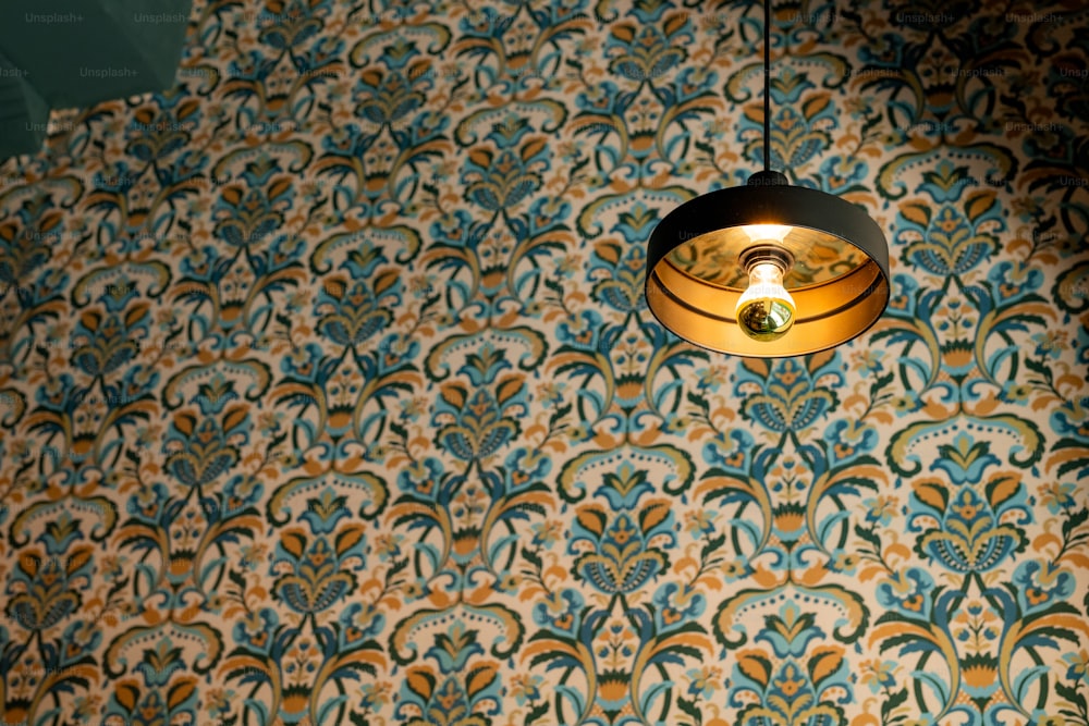 a lamp hanging from a ceiling in a room