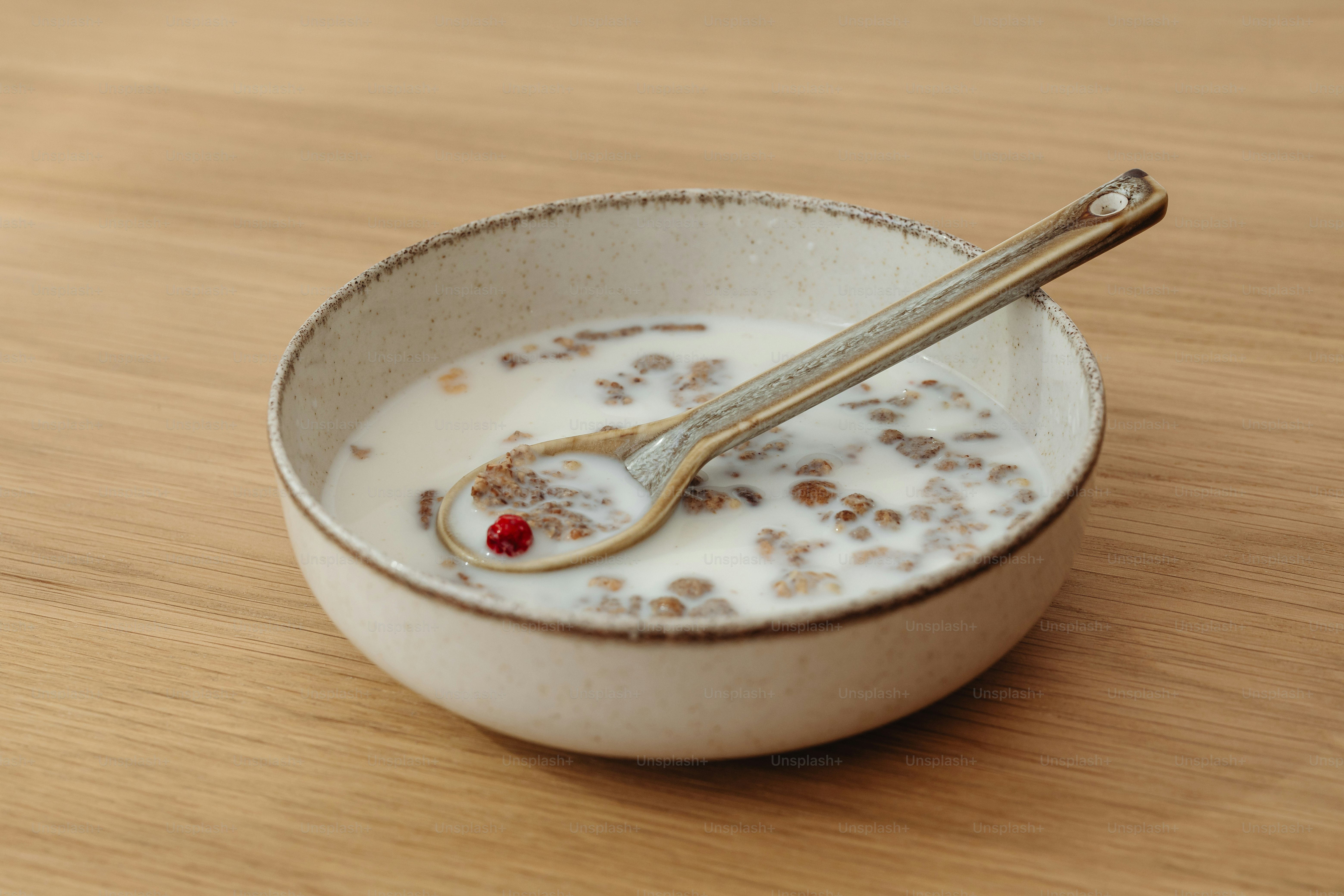 a bowl of cereal with a spoon in it