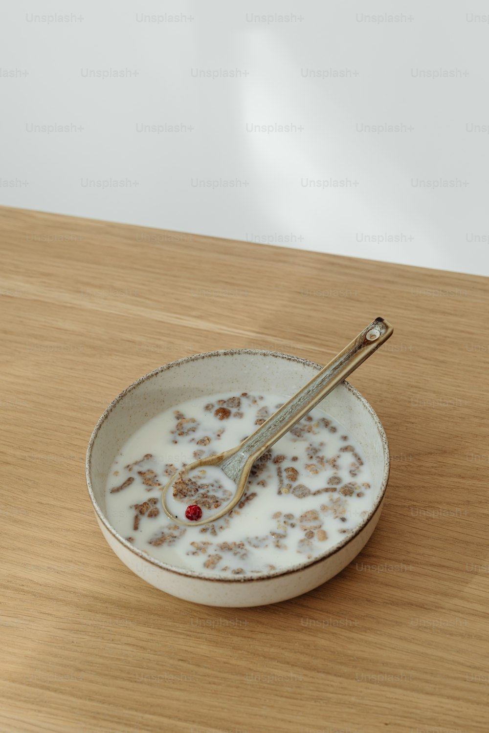 a bowl of cereal with a spoon in it