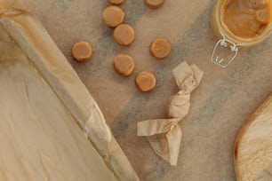 a wooden spoon and some peanut butter on a table