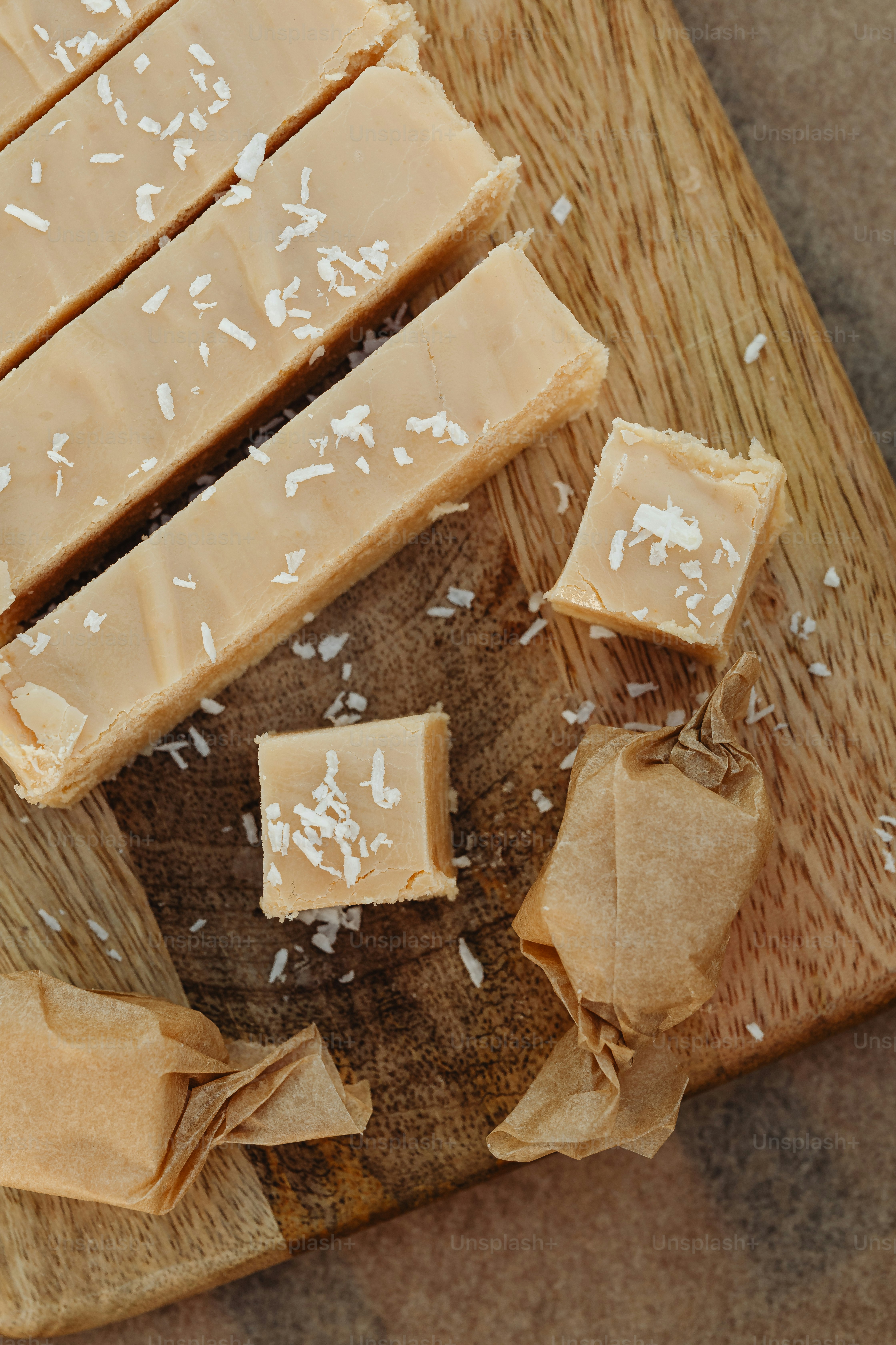 a wooden cutting board topped with pieces of food