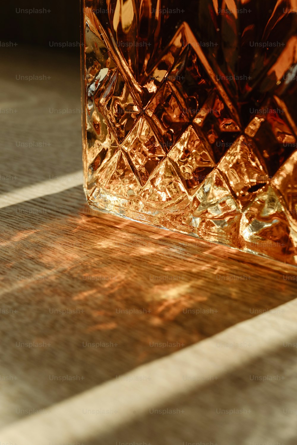 a glass vase sitting on top of a wooden table