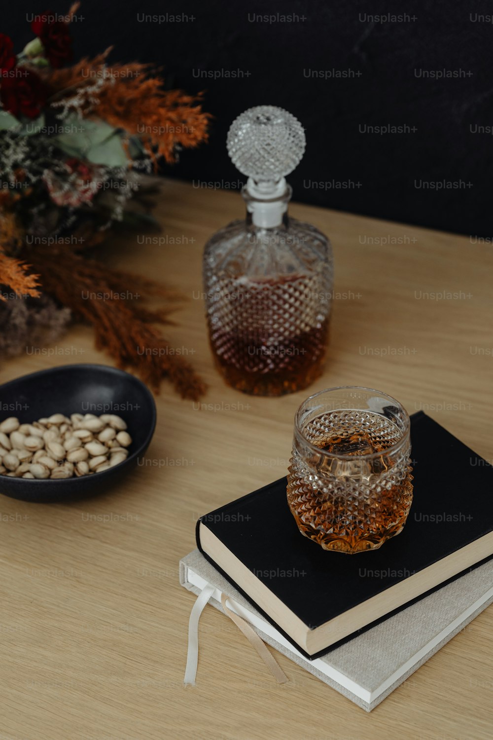 a book and a glass on a table