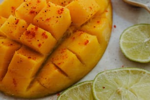 a close up of a sliced up fruit on a plate