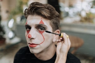 a man with a clown face painted on his face