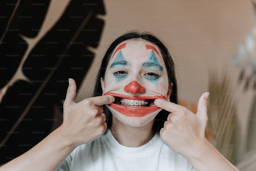 a woman with a clown nose painted on her face