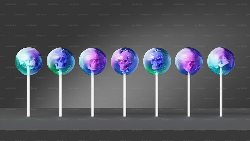 a row of lollipops with a picture of a man on them