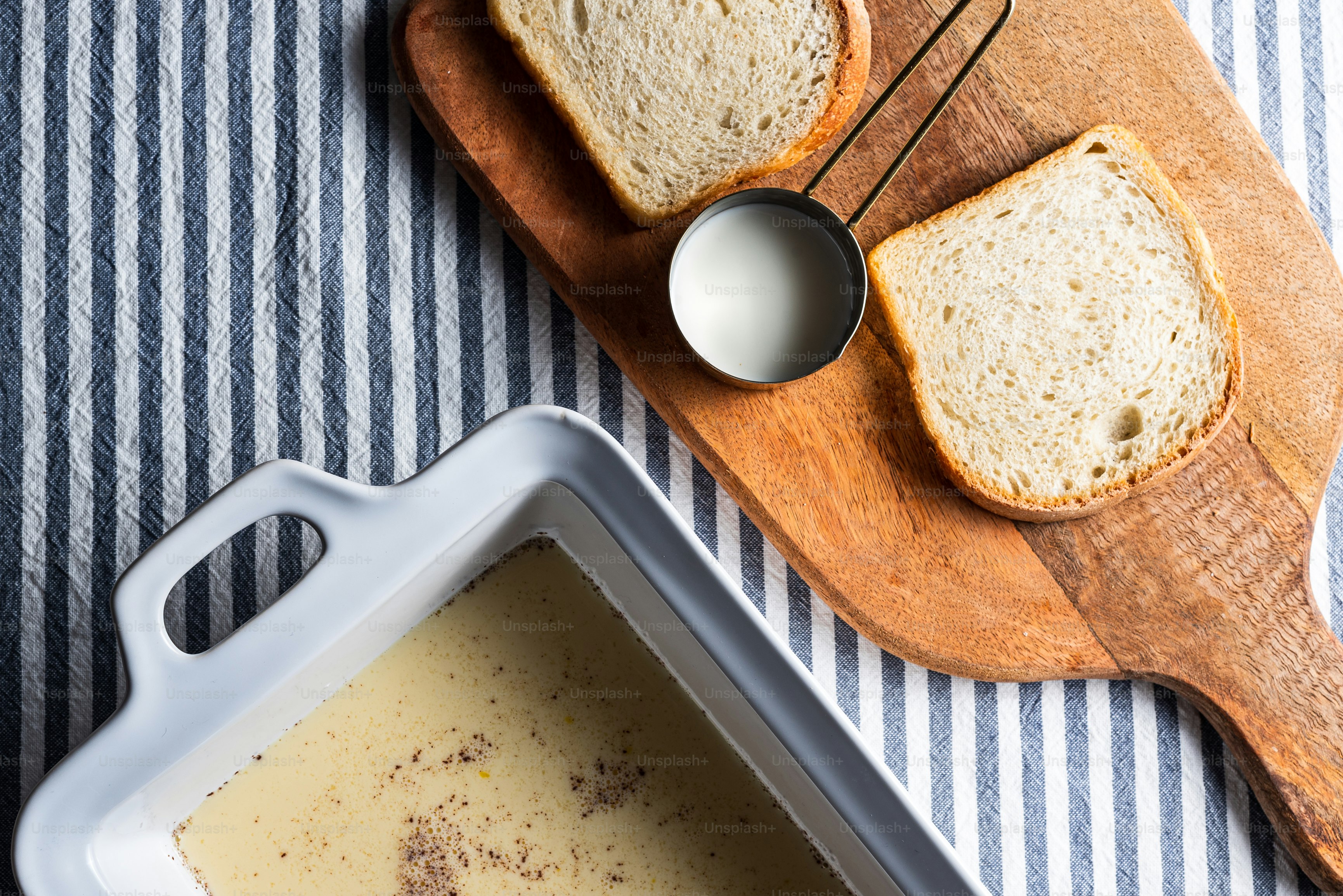 a loaf of bread sitting on top of a wooden cutting board