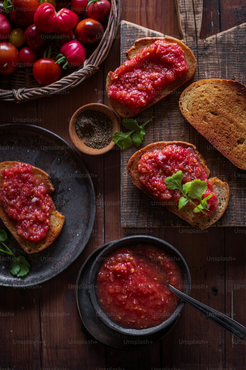 a table topped with bread and bowls of food