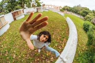 a woman is taking a selfie in a park