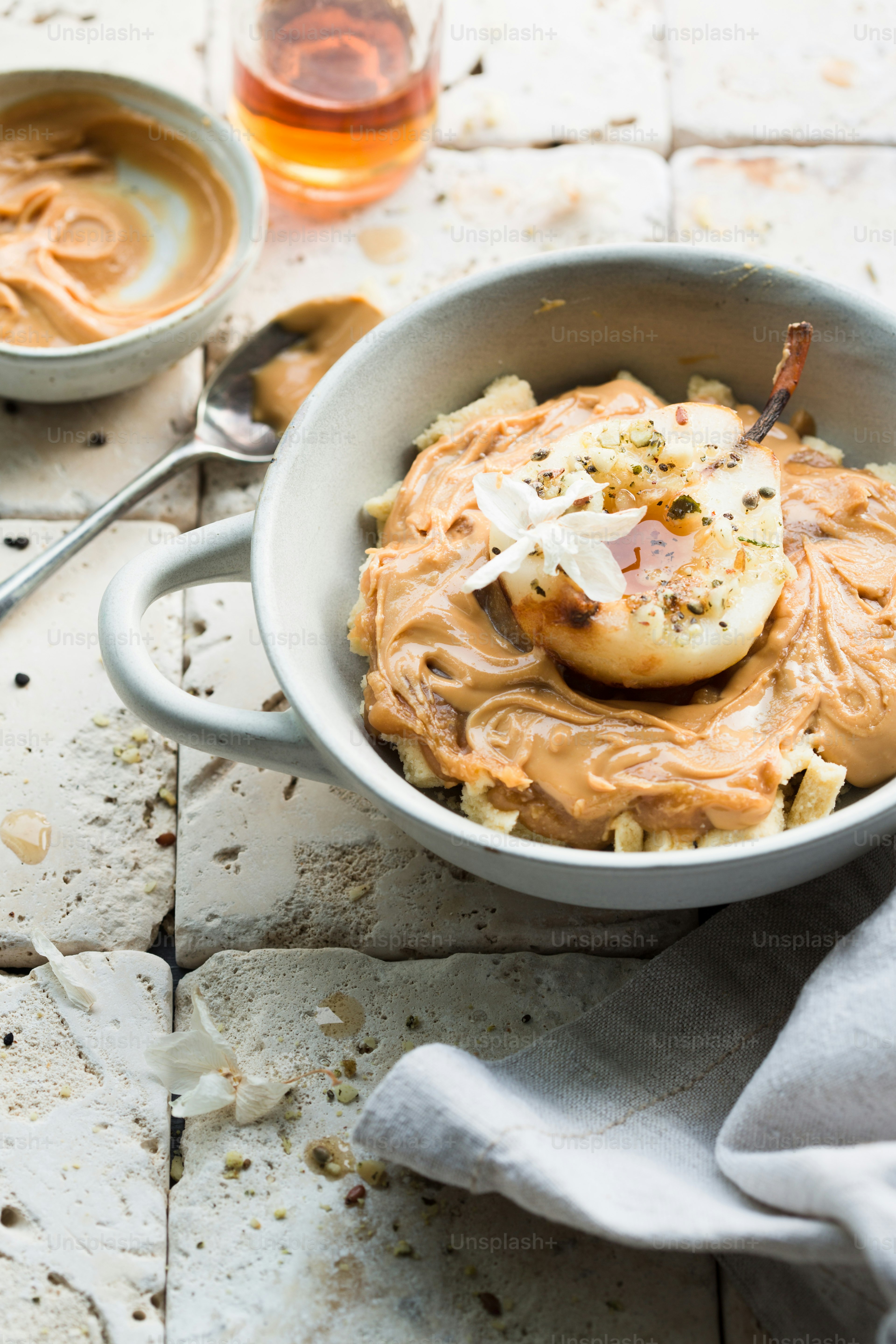 a bowl of food on a table with a spoon