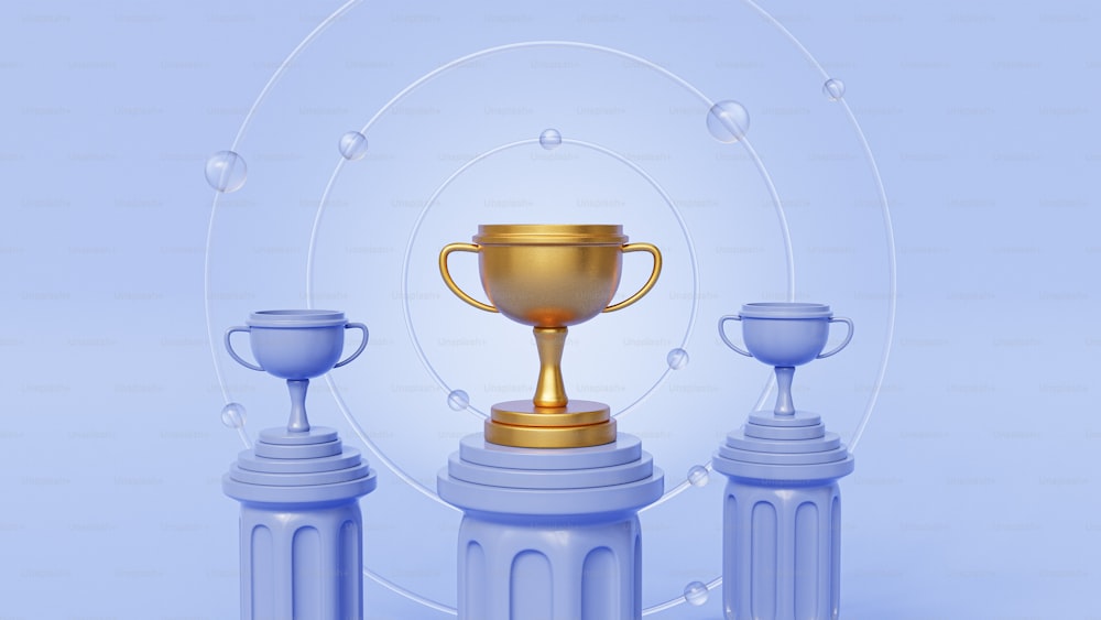 a golden trophy sitting on top of two plastic cups