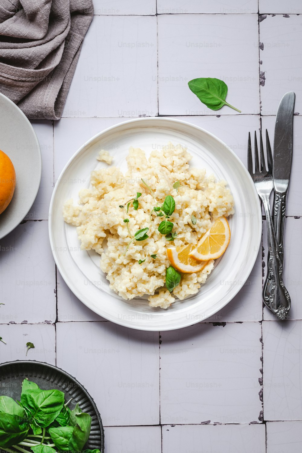 a white plate topped with rice and orange slices
