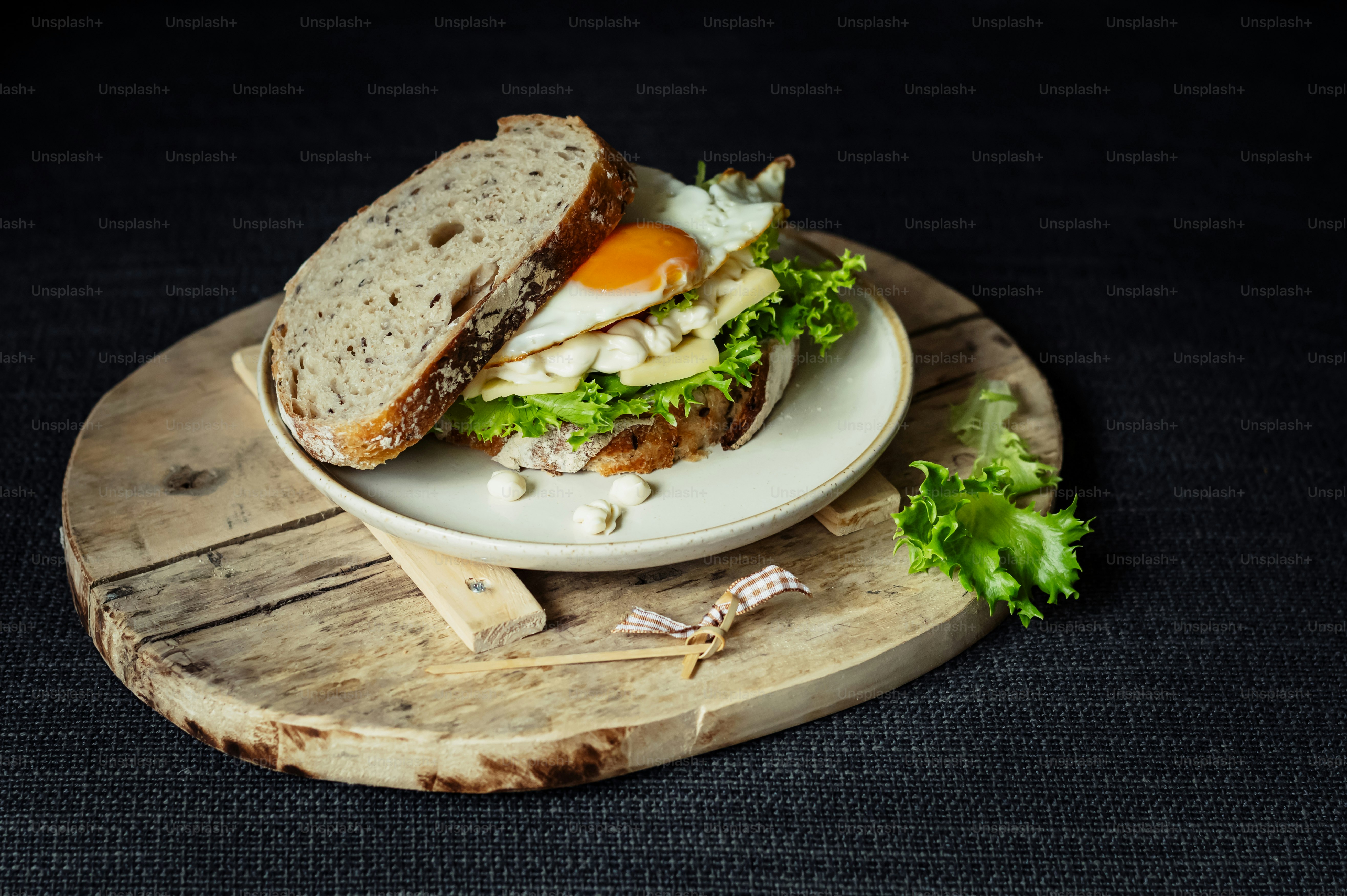 a plate with a sandwich on it sitting on a table