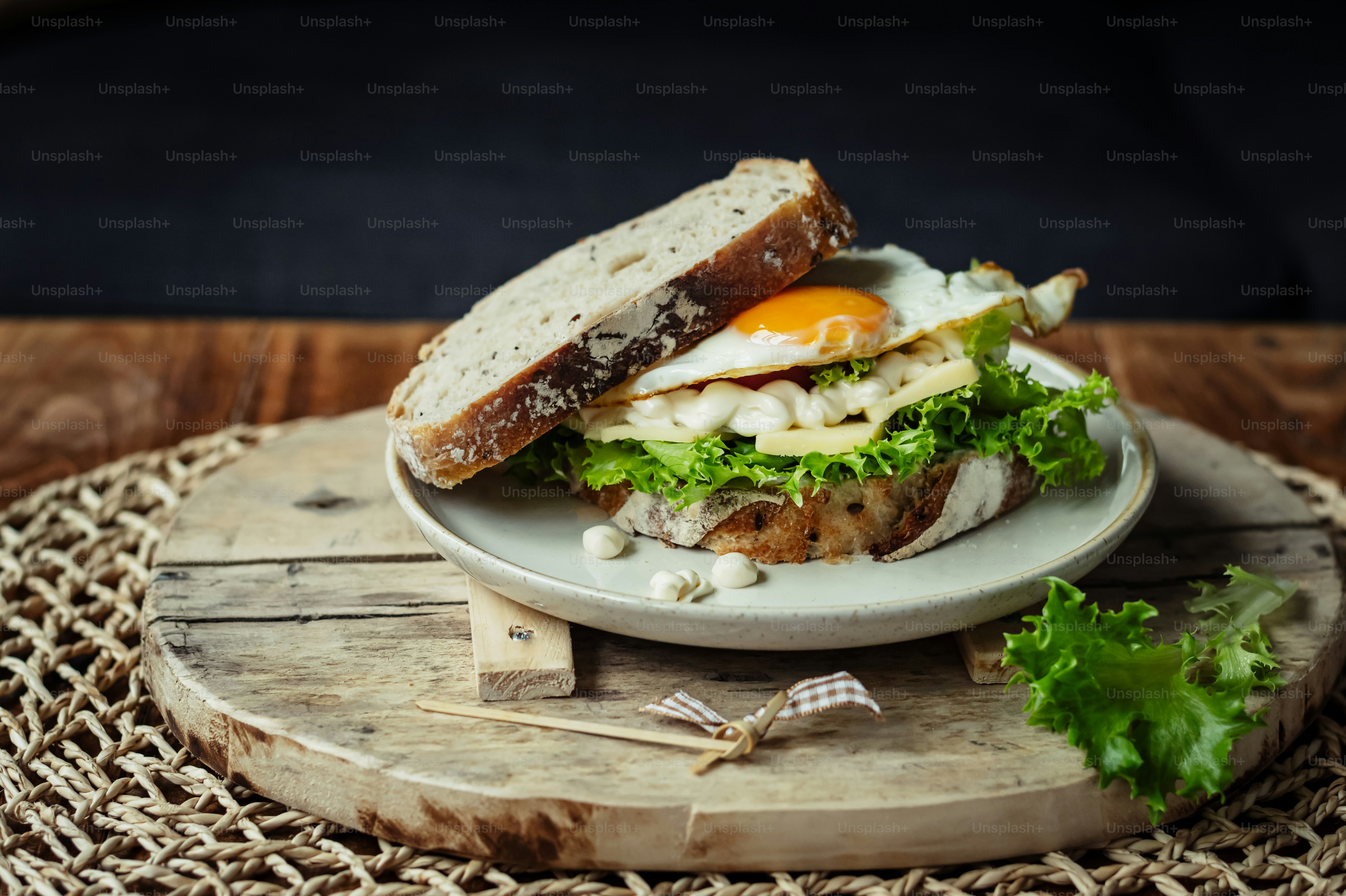 a plate with a sandwich on it sitting on a table
