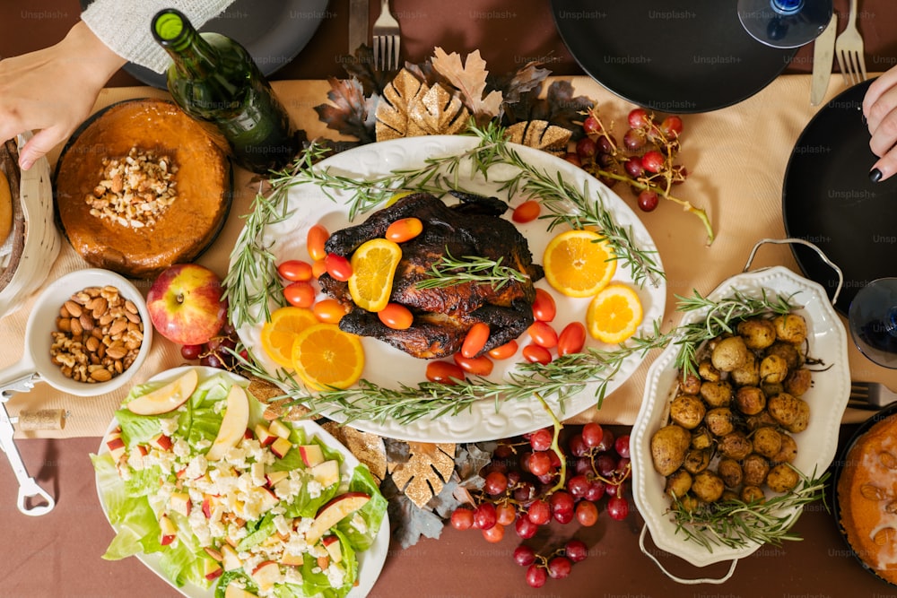 a table full of food with plates of food on it