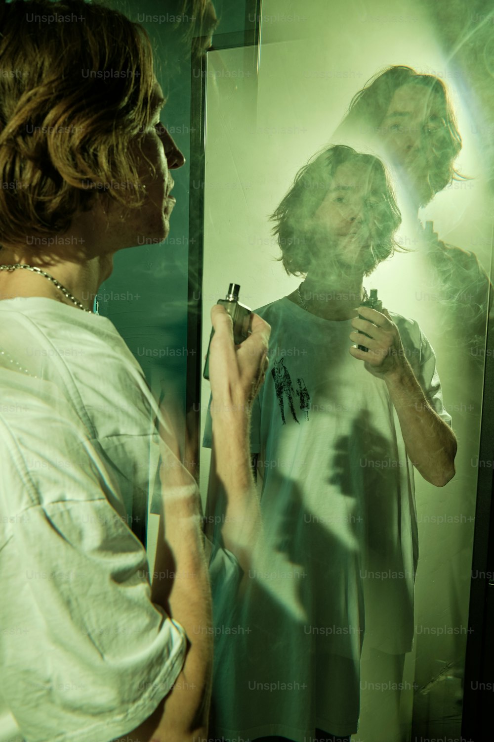 a man standing in front of a mirror brushing his teeth