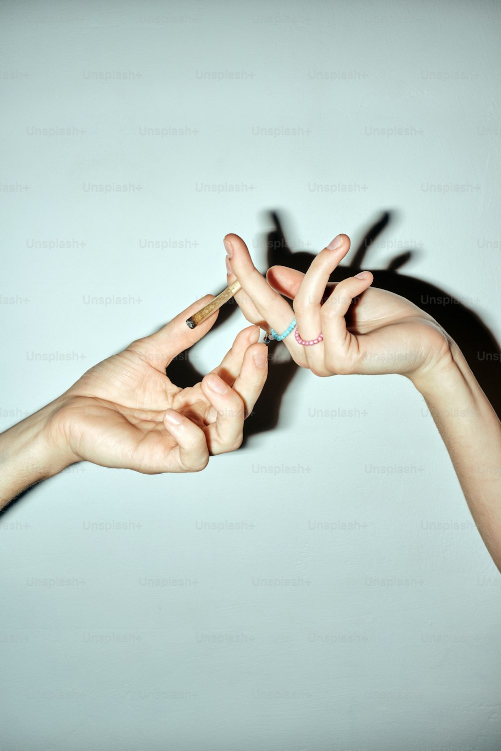 a group of people reaching out their hands to grab something