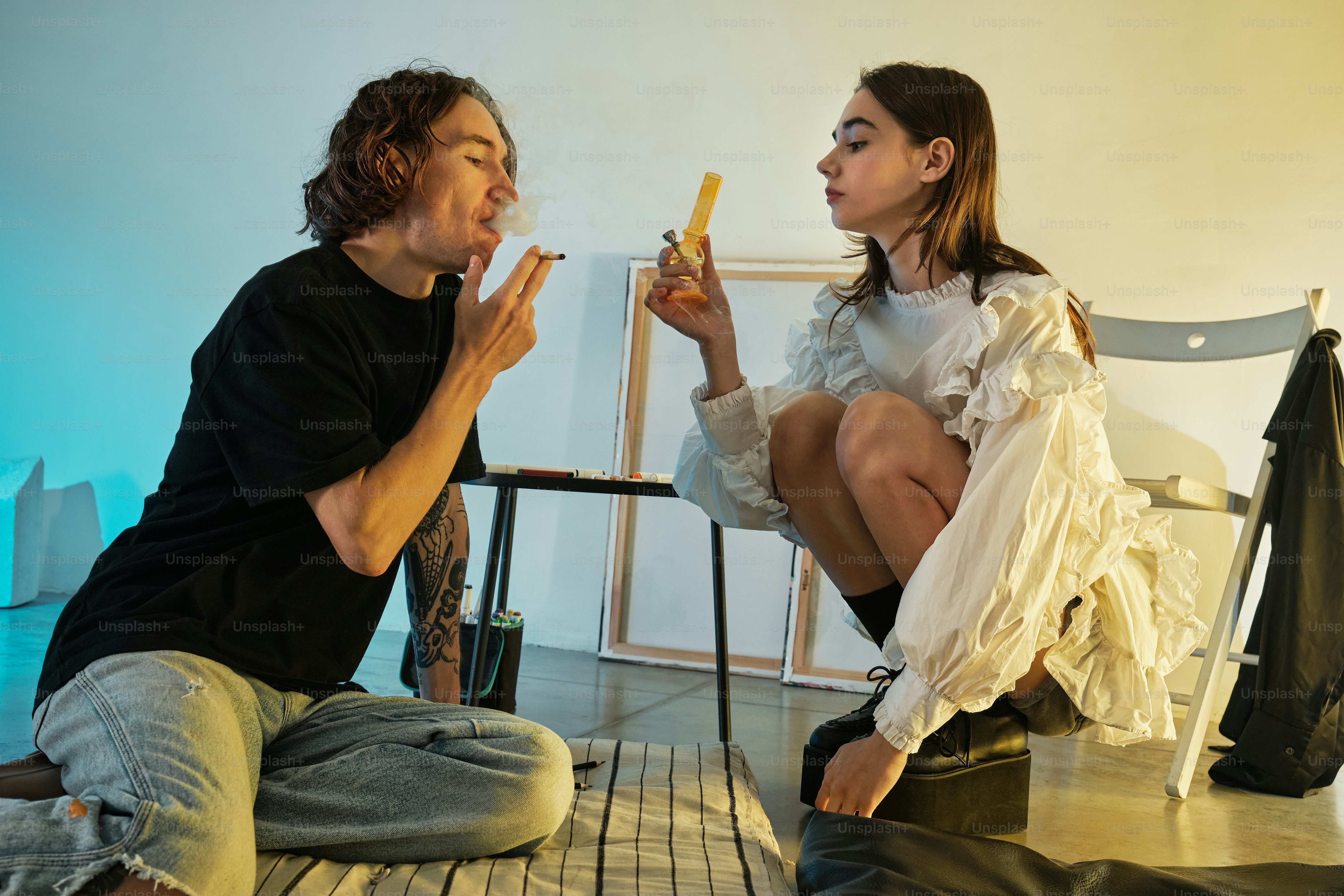 a man and a woman sitting on the floor