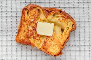 a piece of bread with butter on top of it