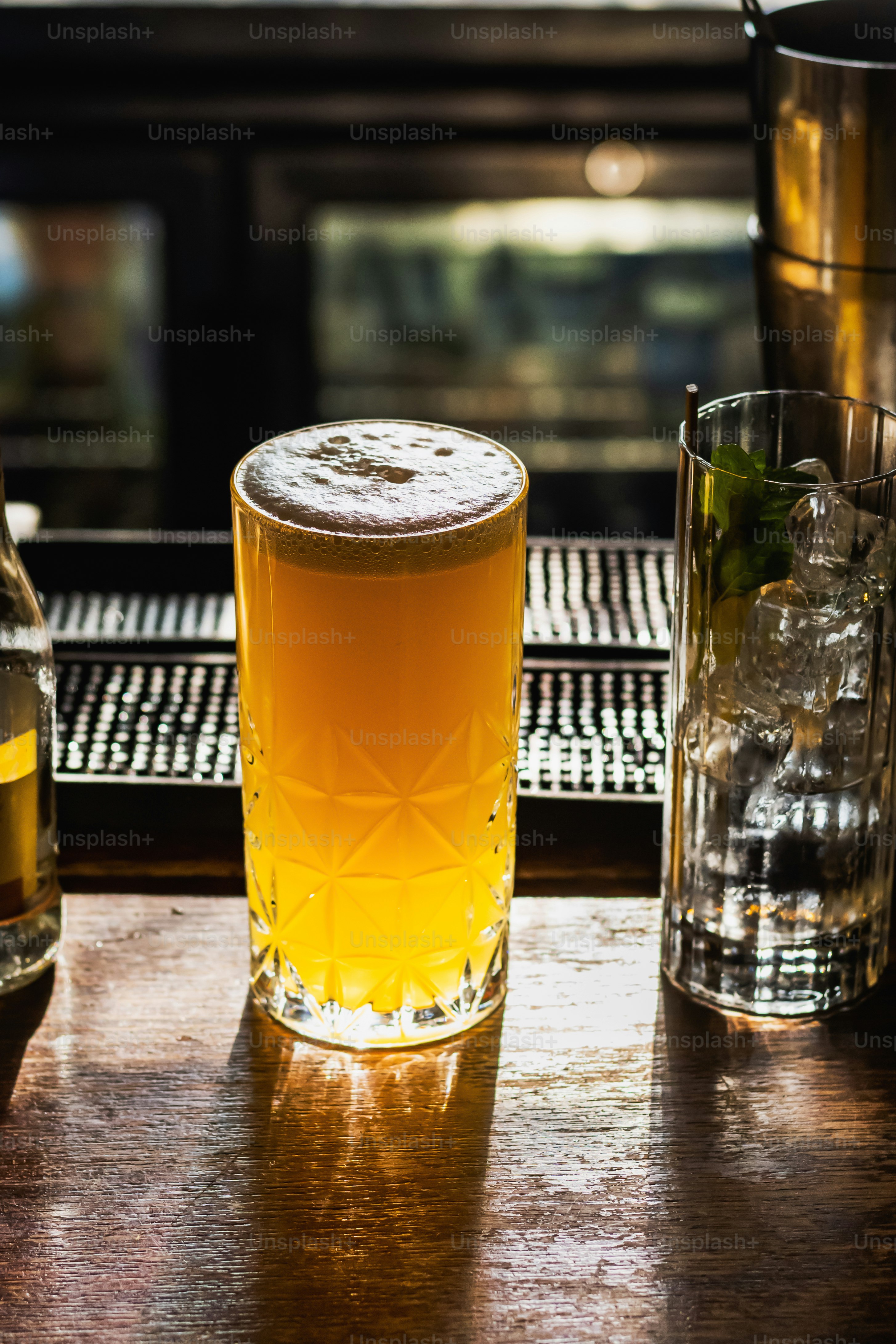 a close up of a glass of beer on a table