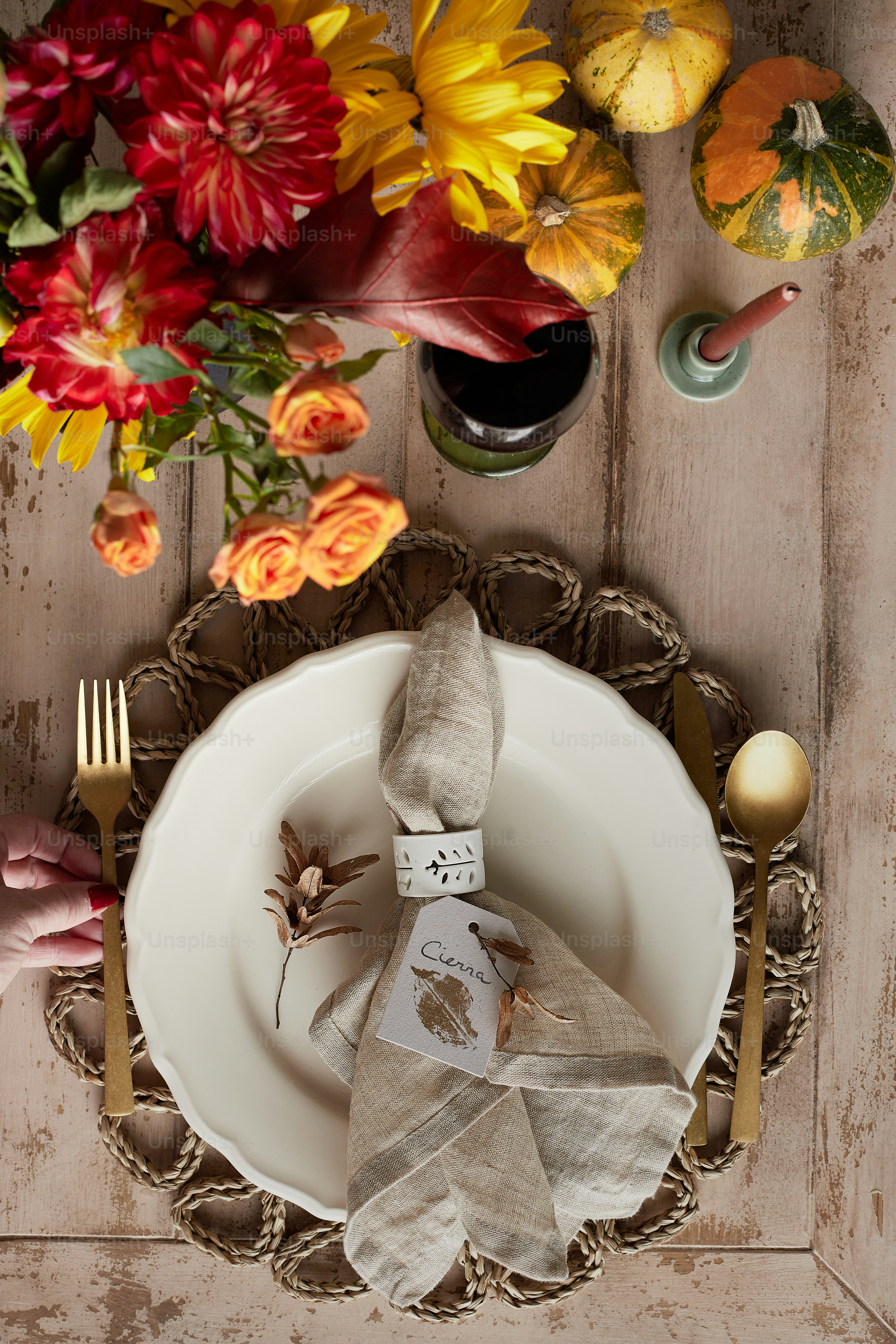 a white plate topped with a napkin and a fork