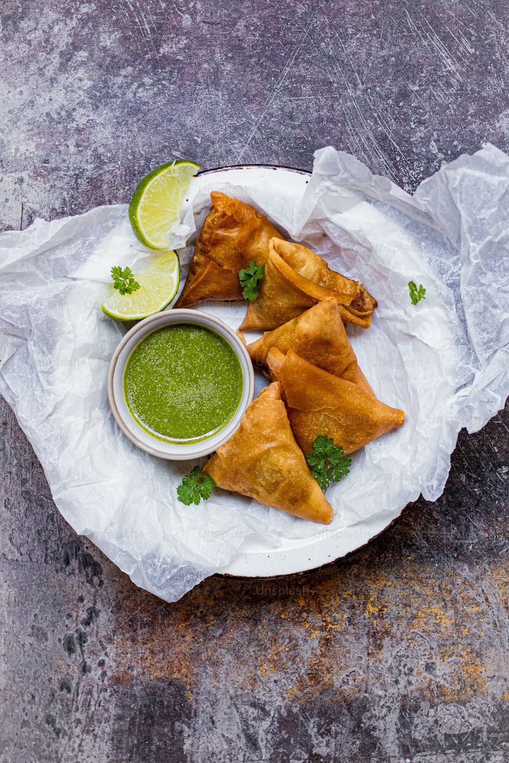 a plate of food with some dipping sauce