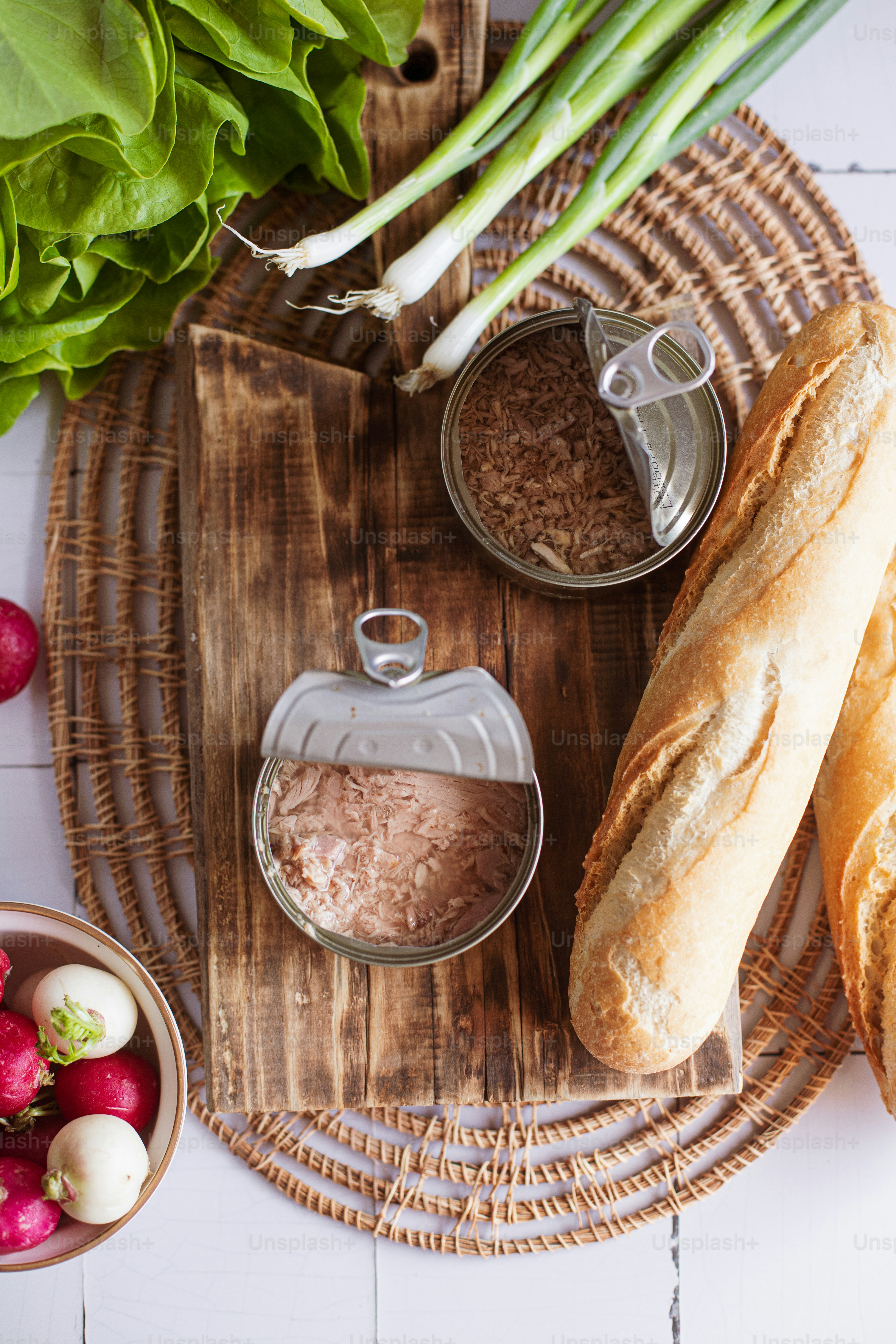 bread, radishes, and other ingredients on a wooden tray