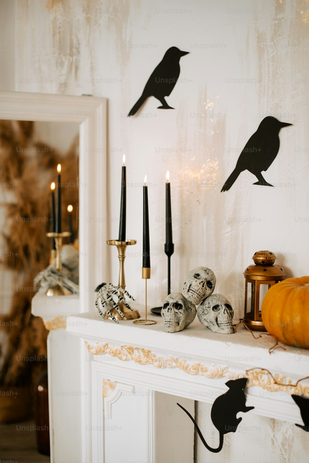 a mantle with candles and decorations on it