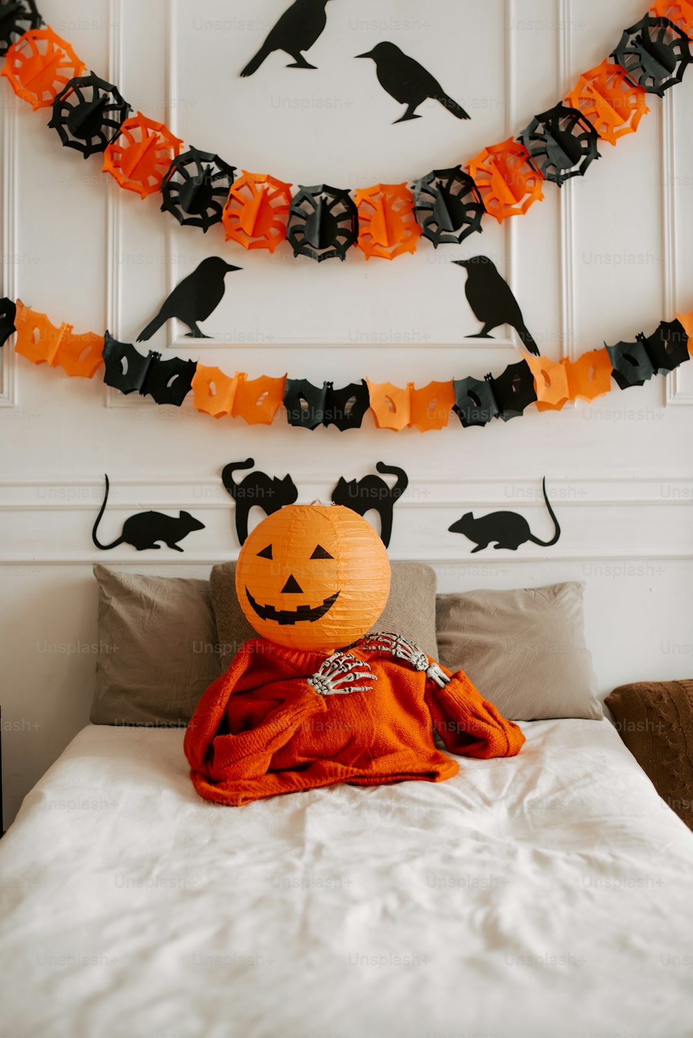 a bed with a halloween decoration on it