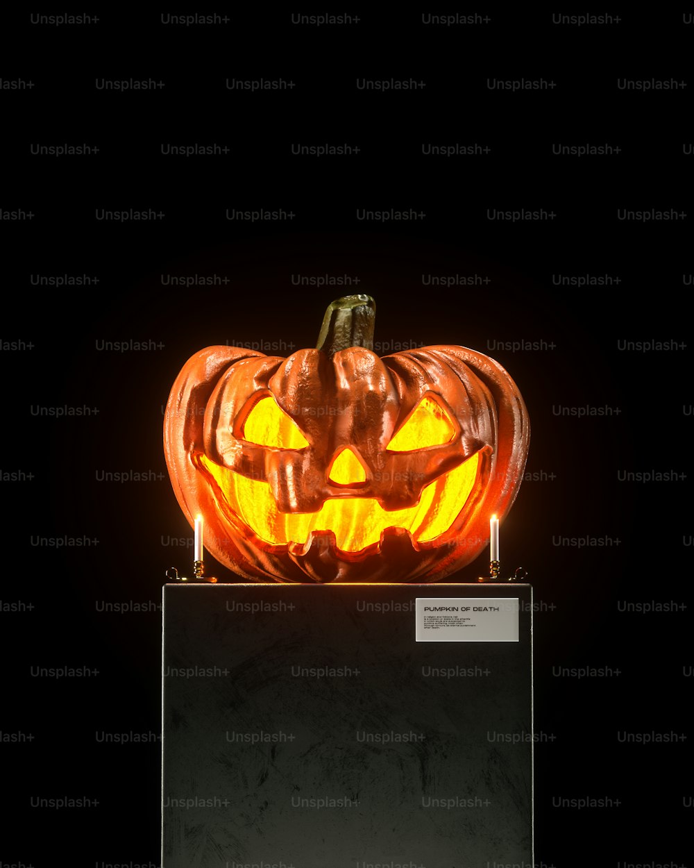 a carved pumpkin sitting on top of a black box