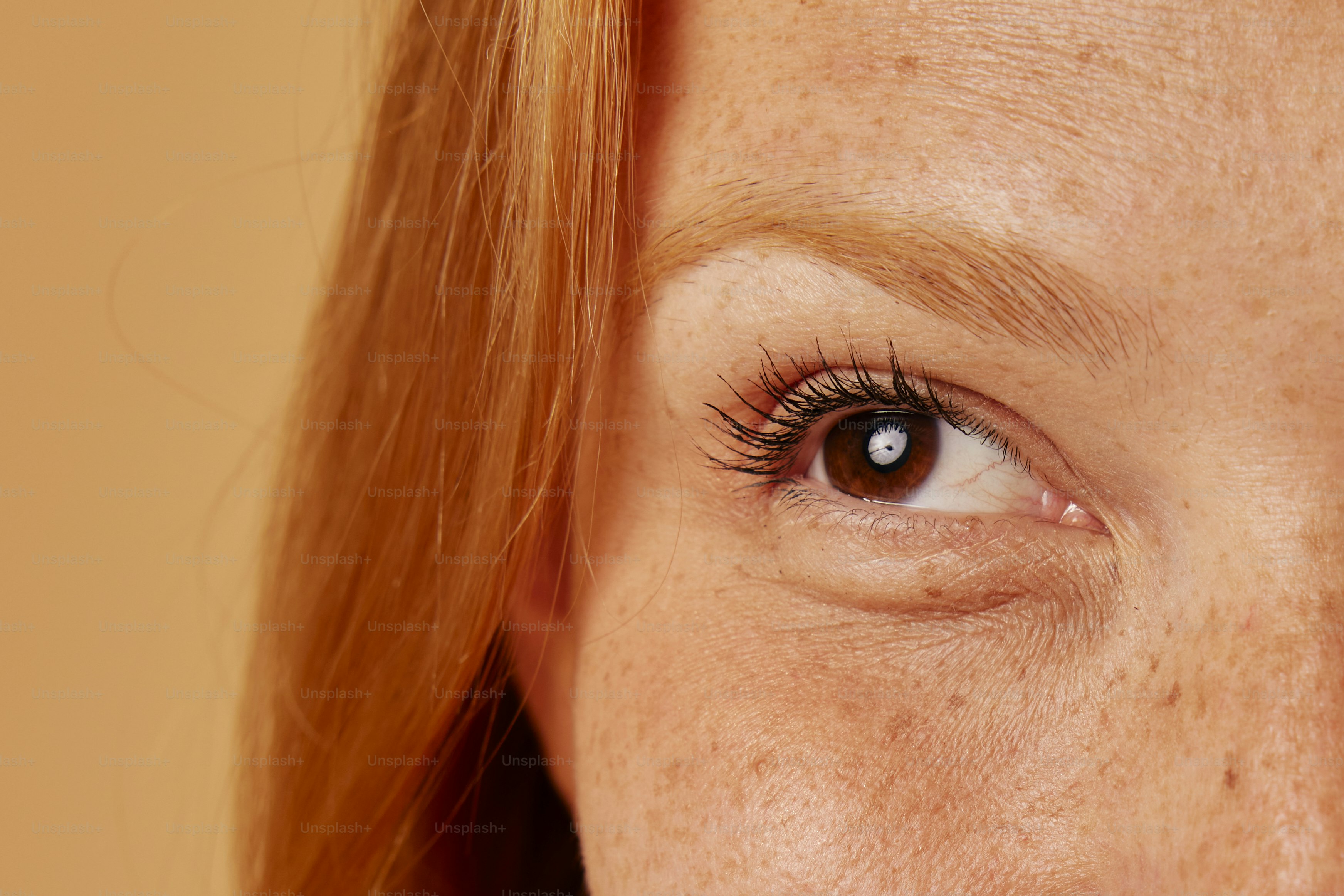 a close up of a woman with red hair