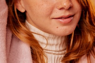 a close up of a woman with freckled hair